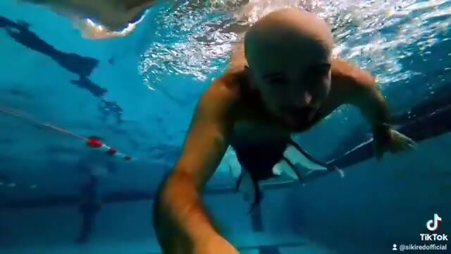 Underwater barefaced bald merman