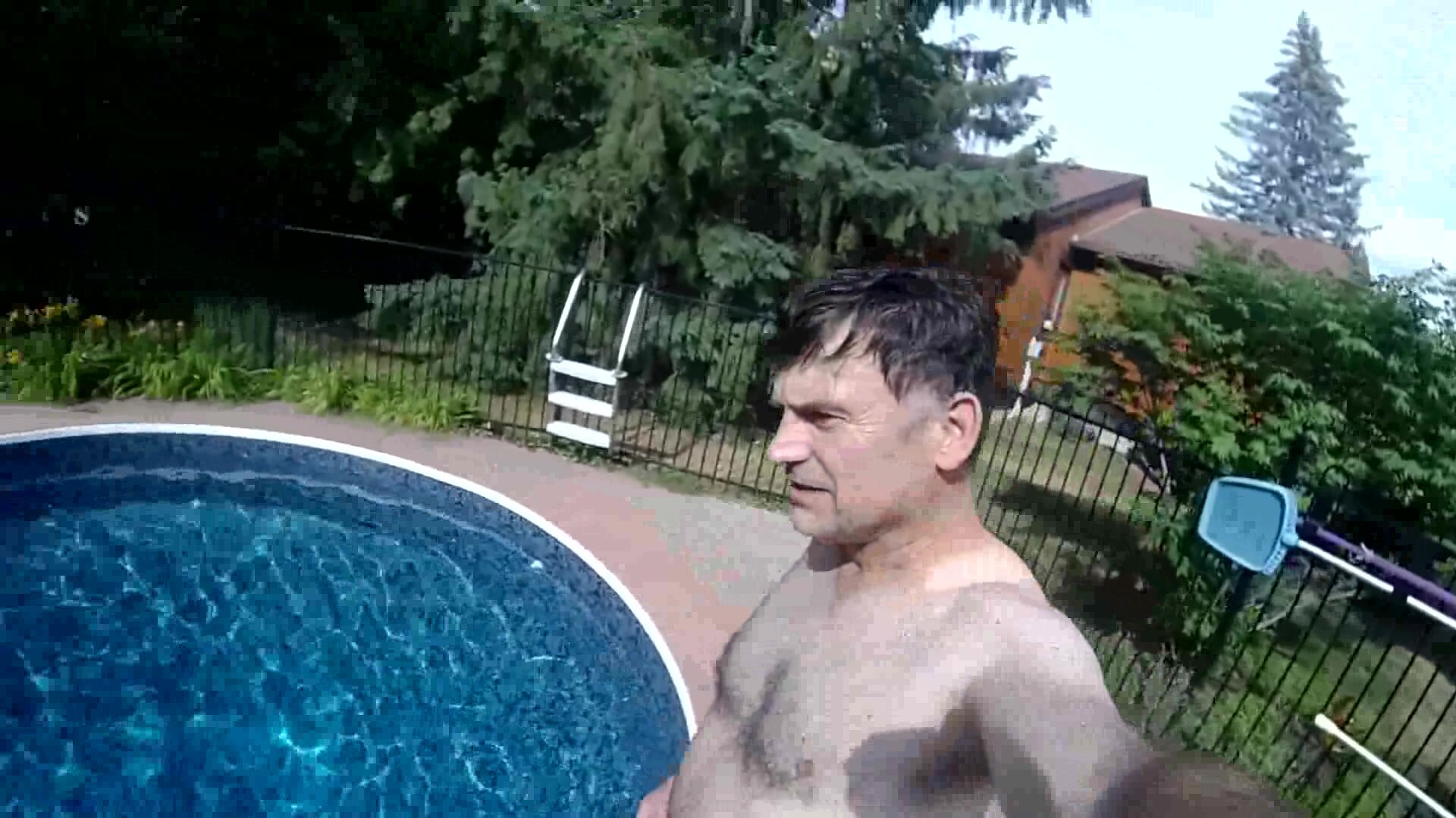 Mature man barefaced underwater in pool
