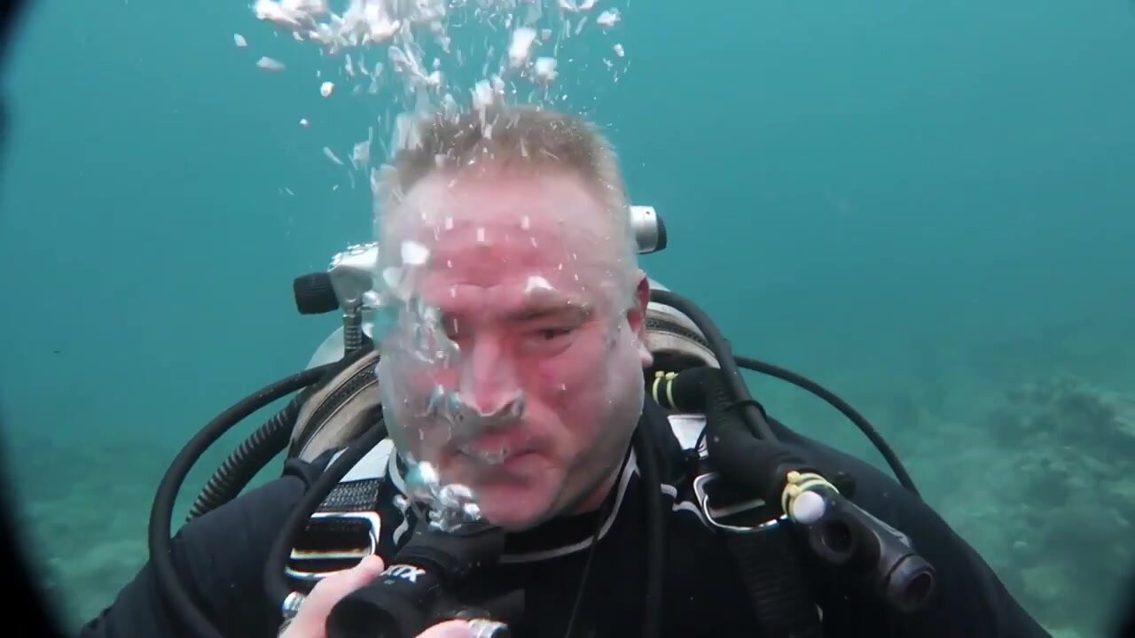 Barefaced mature sexy scubadiver underwater