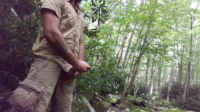 Bearded man jerks in the woods