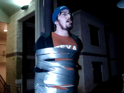 college guy taped to pole