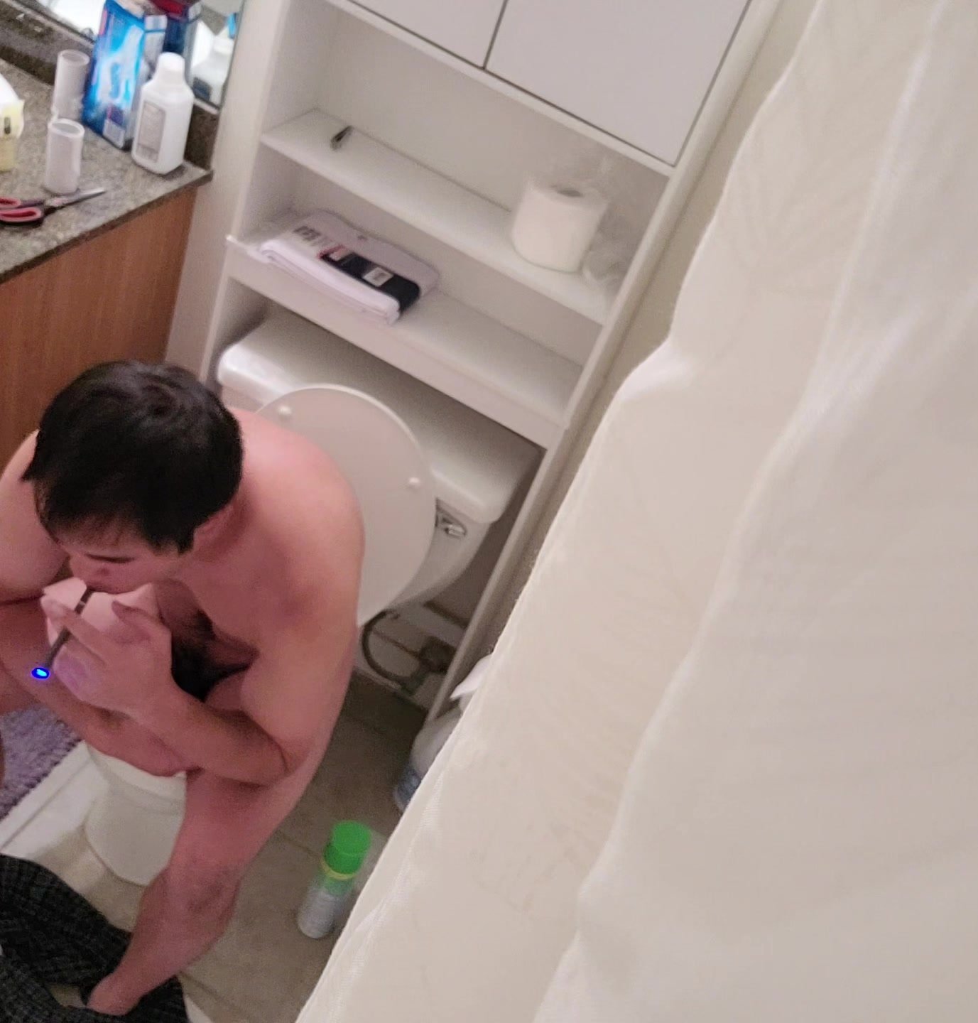 Asian guy spied naked and taking a shit and cleaning penis