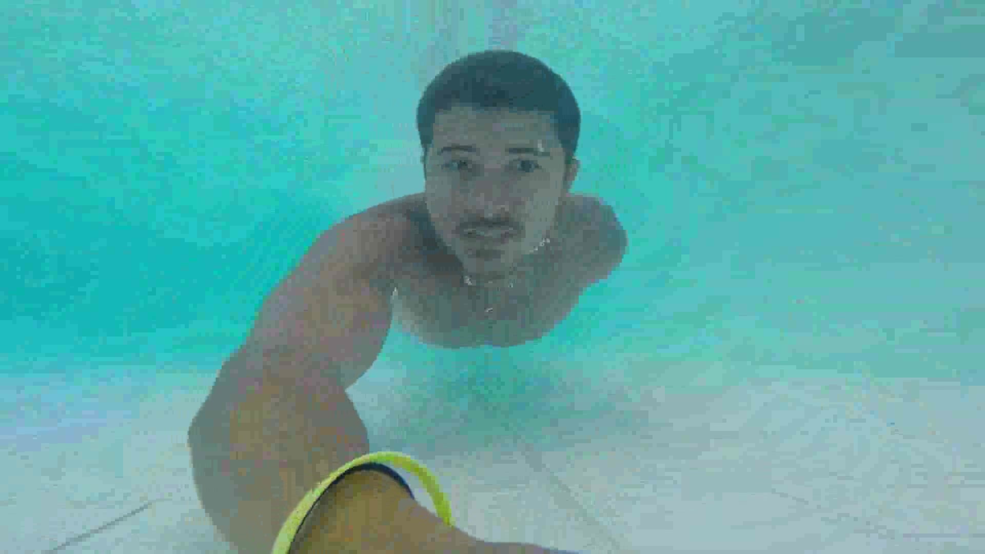 Latino swimming barefaced underwater