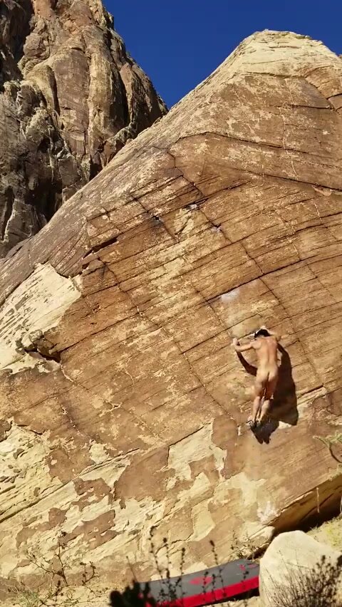 Nude Rock Climber Goes Up
