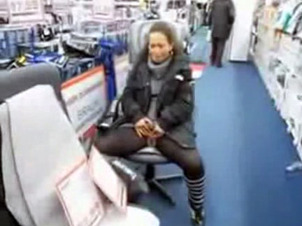 Young wife peeing on the floor of the German store