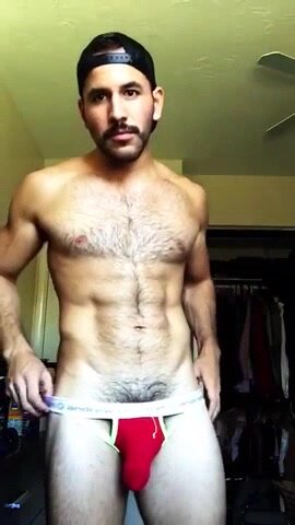 Hot latino guy teasing us with his bulge