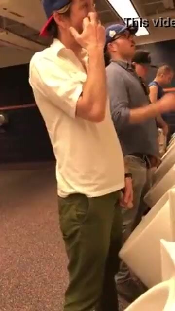 sexy guy goes hands free piss at urinal