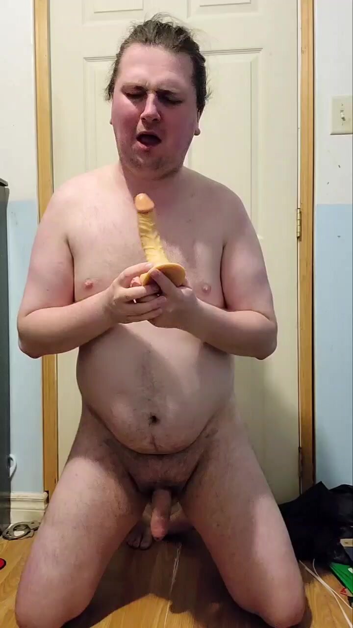 Faggot gagging himself on multiple dildos