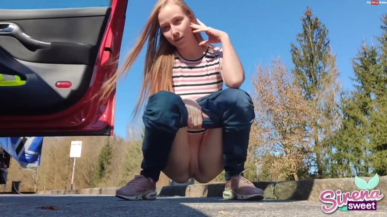 Cute teen pissing next to the road