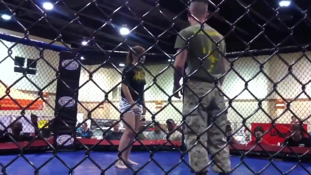 Buff marine is cchoked out by a woman
