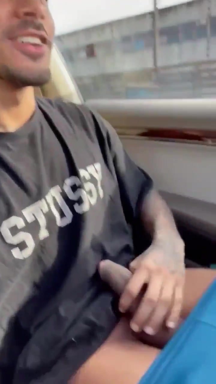 Hunk casually stroking in car