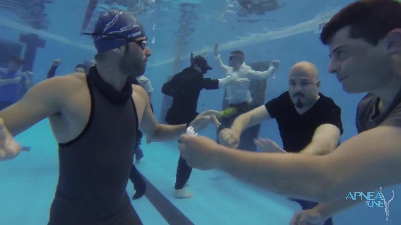Barefaced italian buddies breatholding underwater