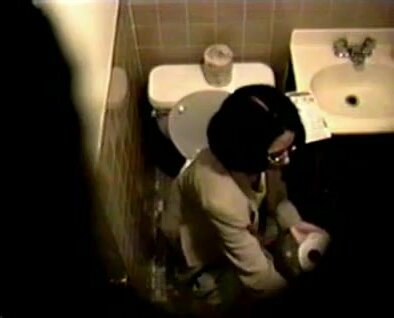 Milf with glasses on toilet