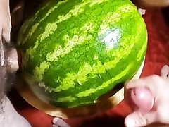 Guys share a watermelon