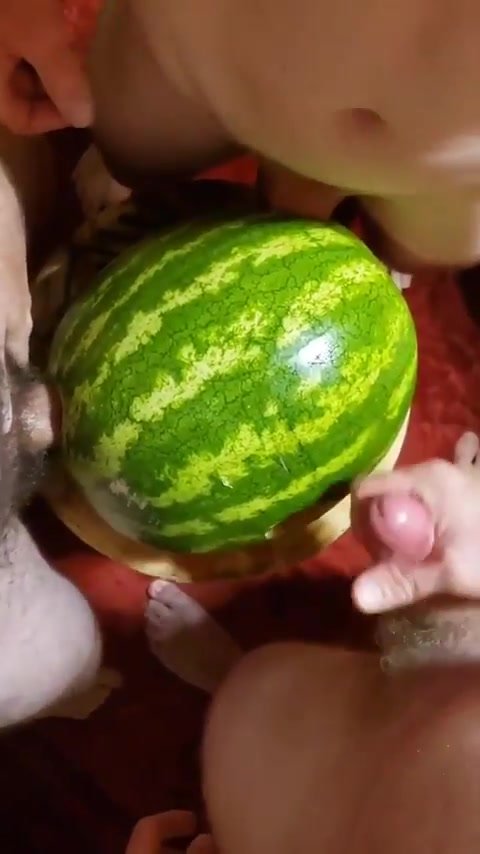 Guys share a watermelon