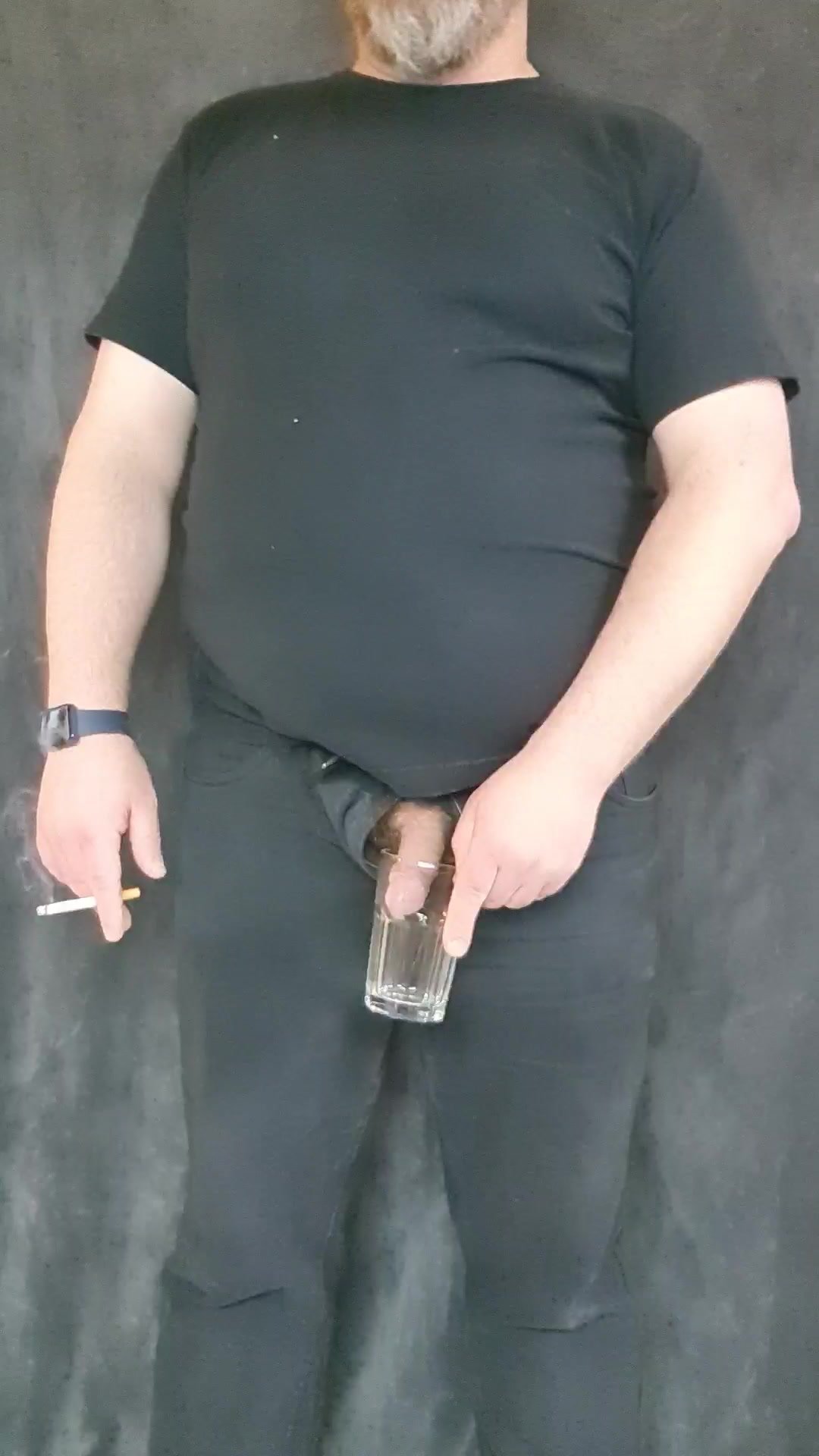 pissing in a glass fully clothed