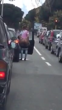 Woman piss at road