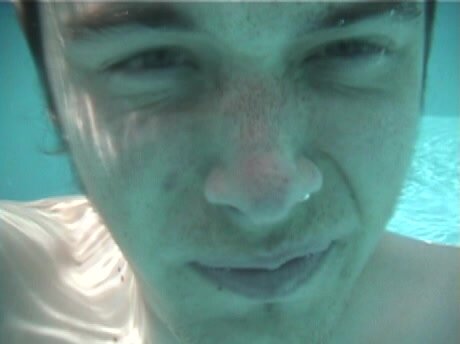 Underwater barefaced selfie in slowmotion