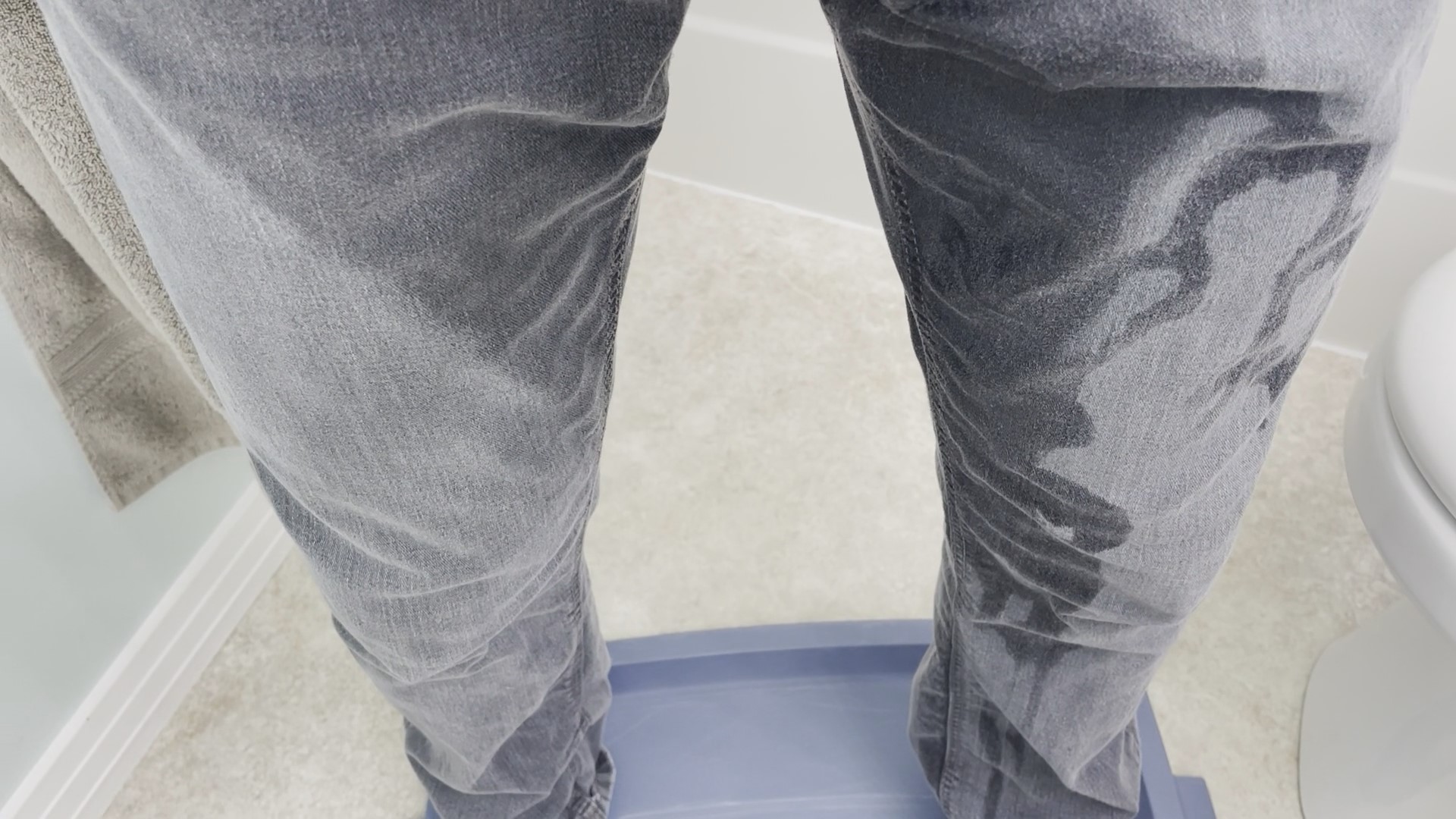 Wet jeans in the bathroom.