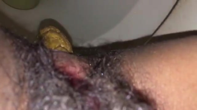 Nice closeup of girl's delicious poop and hairy cunt