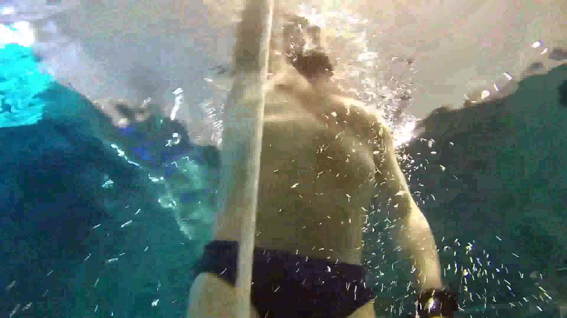 Bearded freediver underwater in black speedo