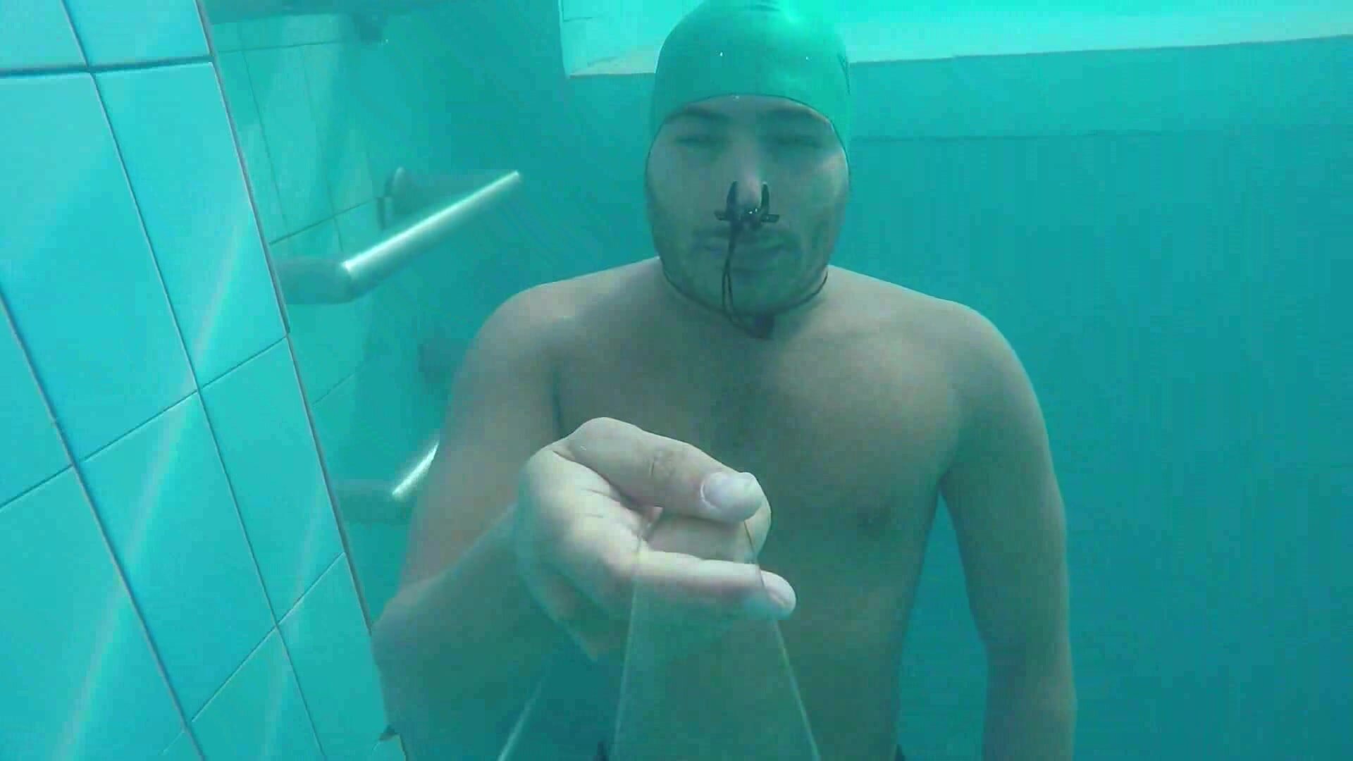 Kareem barefaced underwater with swimcap & noseclip