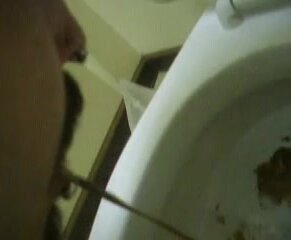 Indonesian Man Vomit at Toilet