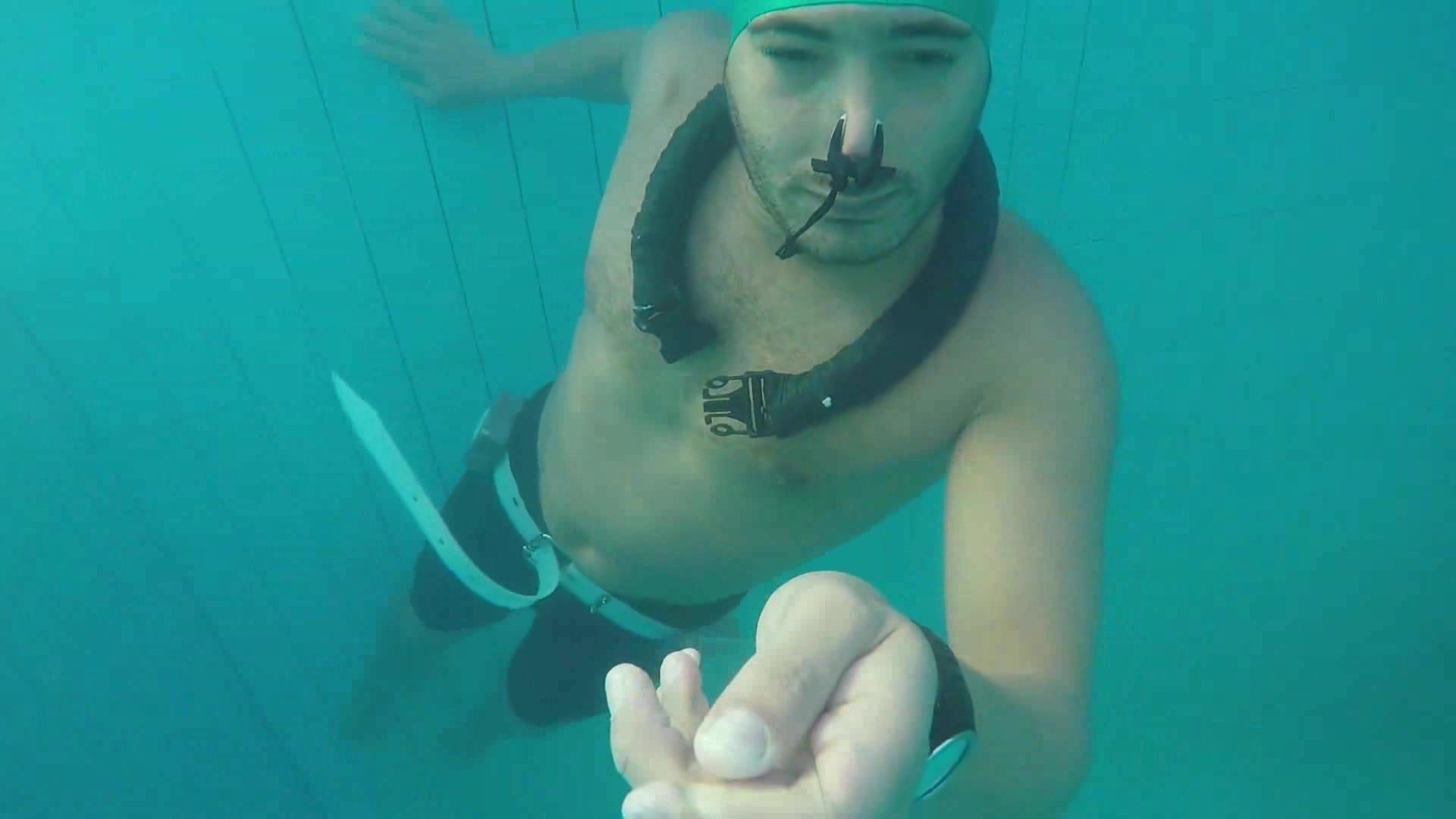 Barefaced Kareem underwater with swimcap & noseclip