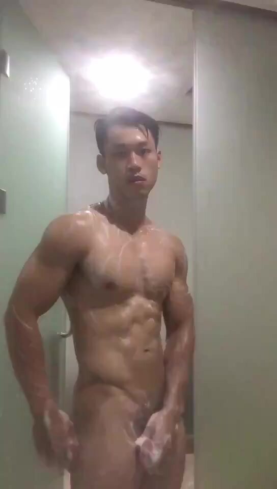 The super hot muscle guy take a shower after workout