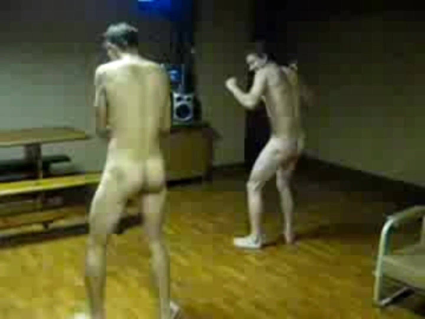 Naked lads dance about