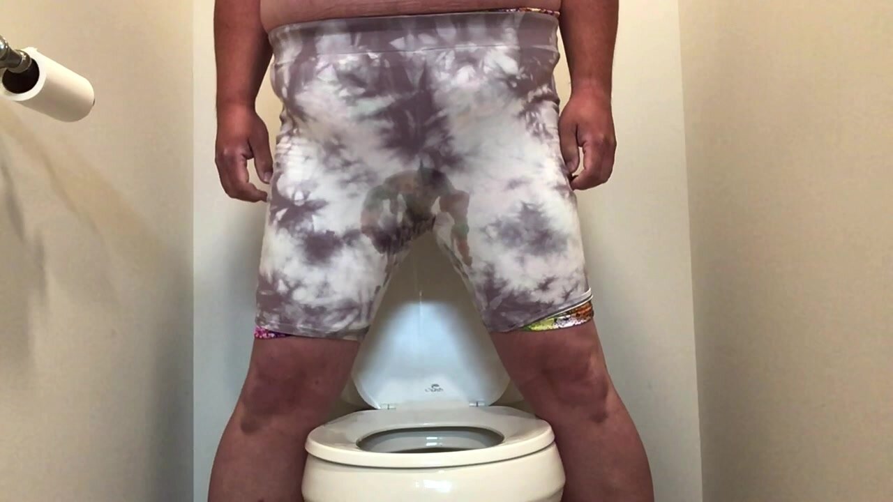Pissing shorts at the toilet
