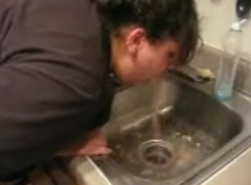 drunk mature puking in sink