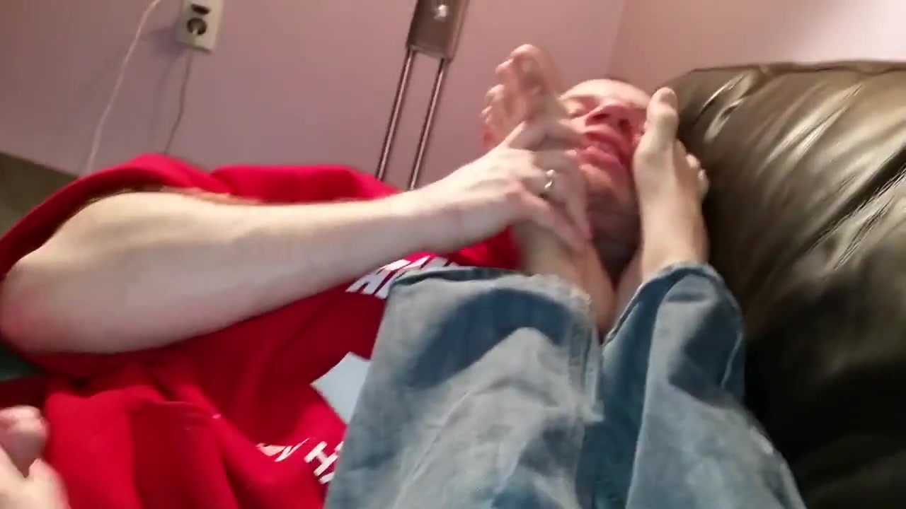 Slave in red shirt jerks off and licks feet!