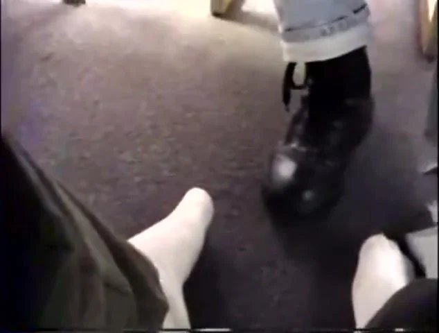 Foot play under table in library - ThisVid.com