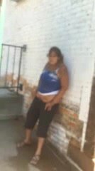 Chubby drunk latina caught pissing on a building