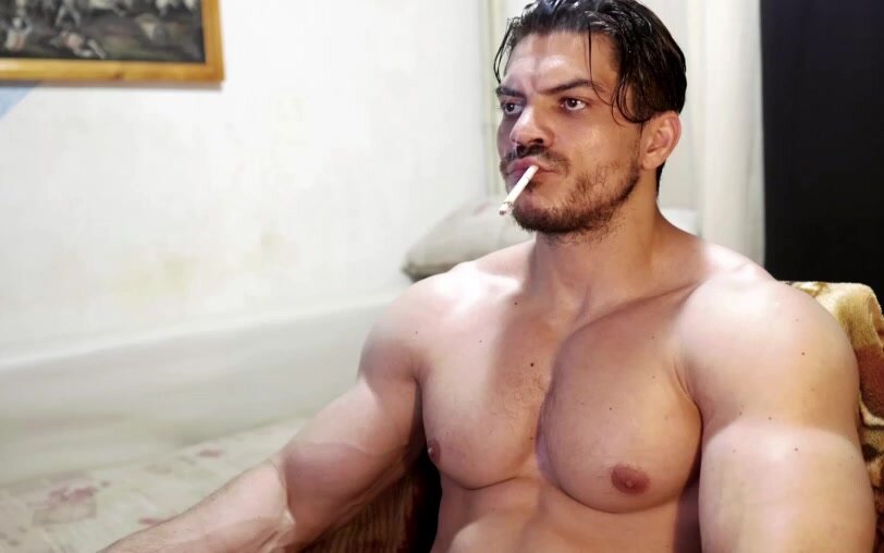 huge muscle guy smoking - video 3