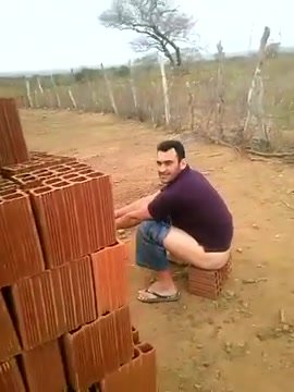 bearded man shitting in construction with flip flops