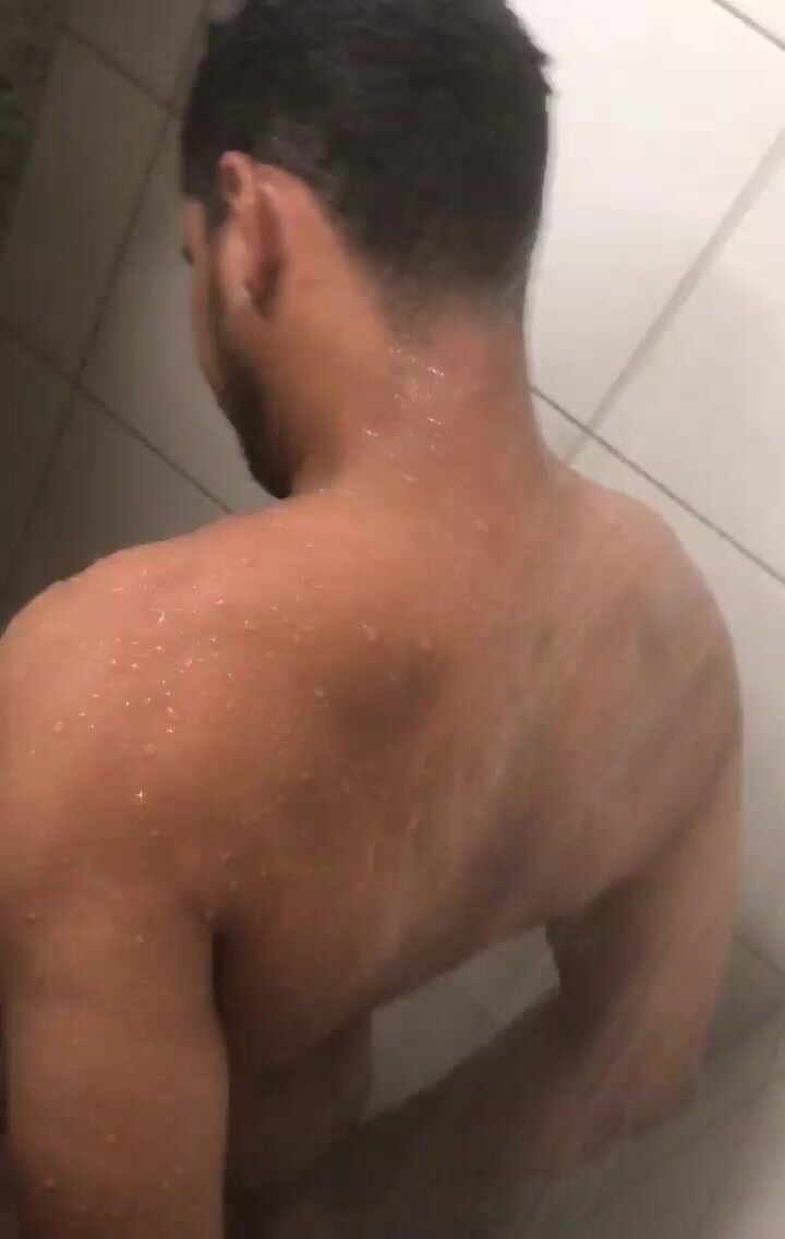 cute guy showering at the gym