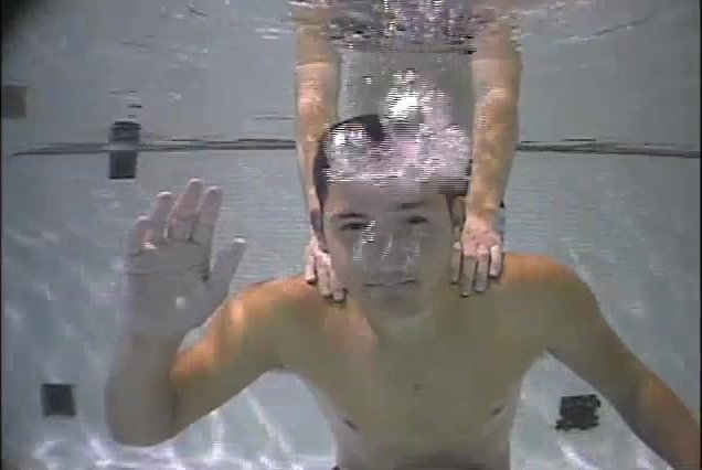 Cute guy letting his air out underwater