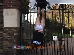 Police Officer Public Humiliation Hanging on fence