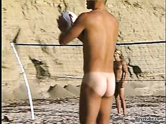 Naked hot guys play volleyball on the beach