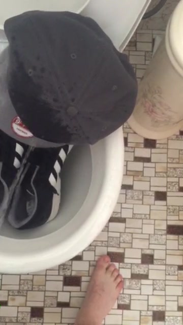 Slave boy pisses sneakers and hat