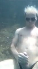 Blond twink jerking off and cumming underwater
