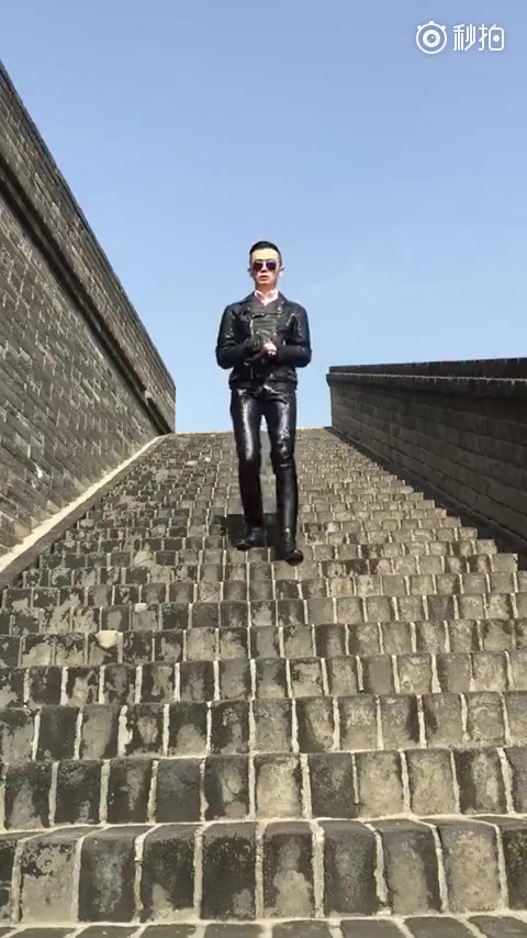 Cute Handsome Chinese Boot Master in Full Leather Walking Downstairs
