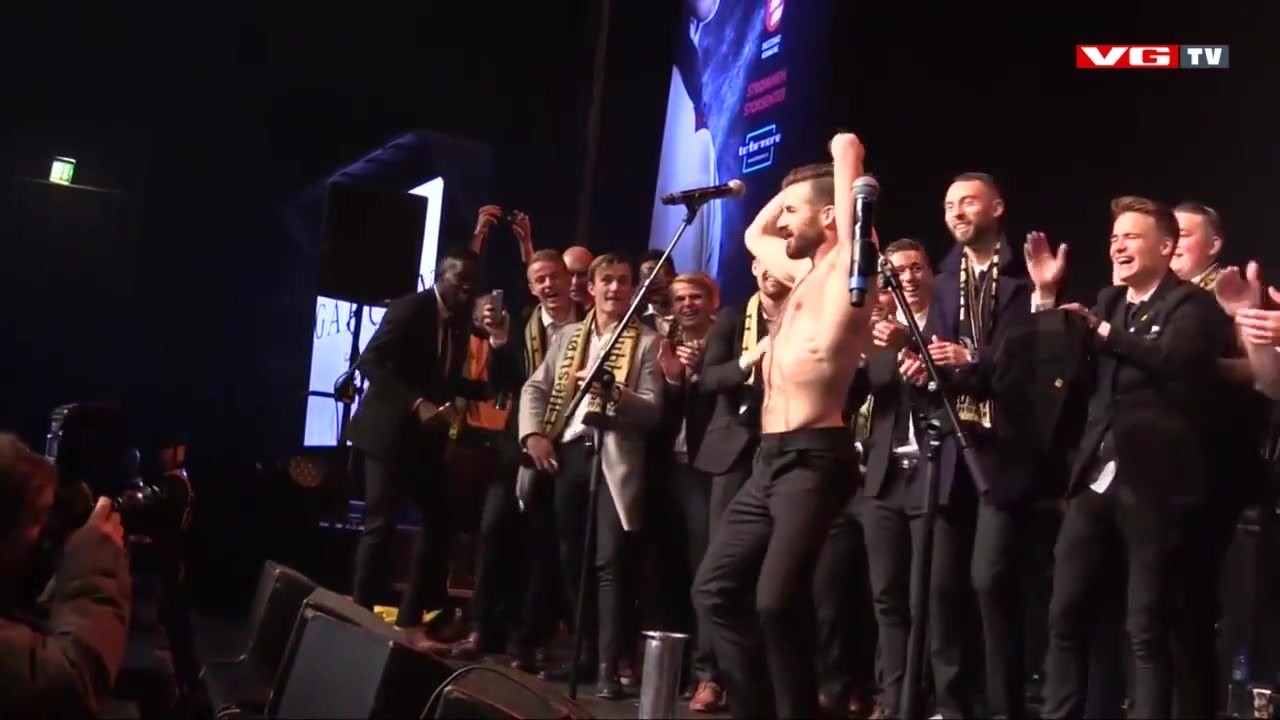 Guy strips on stage.