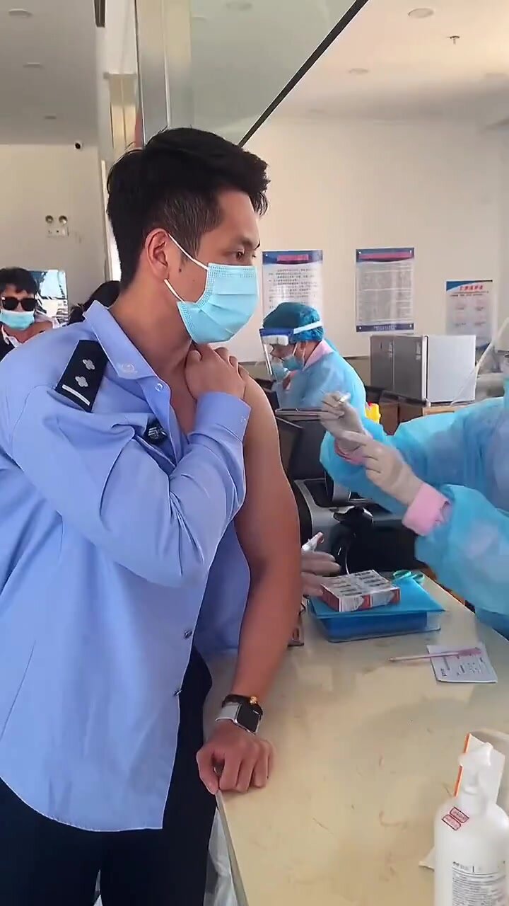 Handsome Chinese Policeman Getting His Vaccination