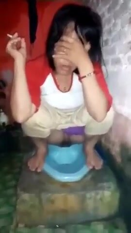 girl pooping in squat toilet