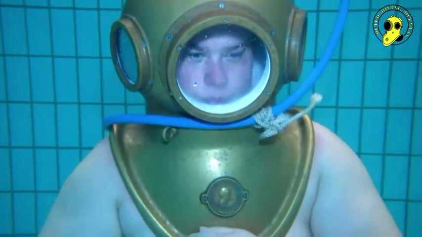 Dutch helmet diver barefaced underwater in pool