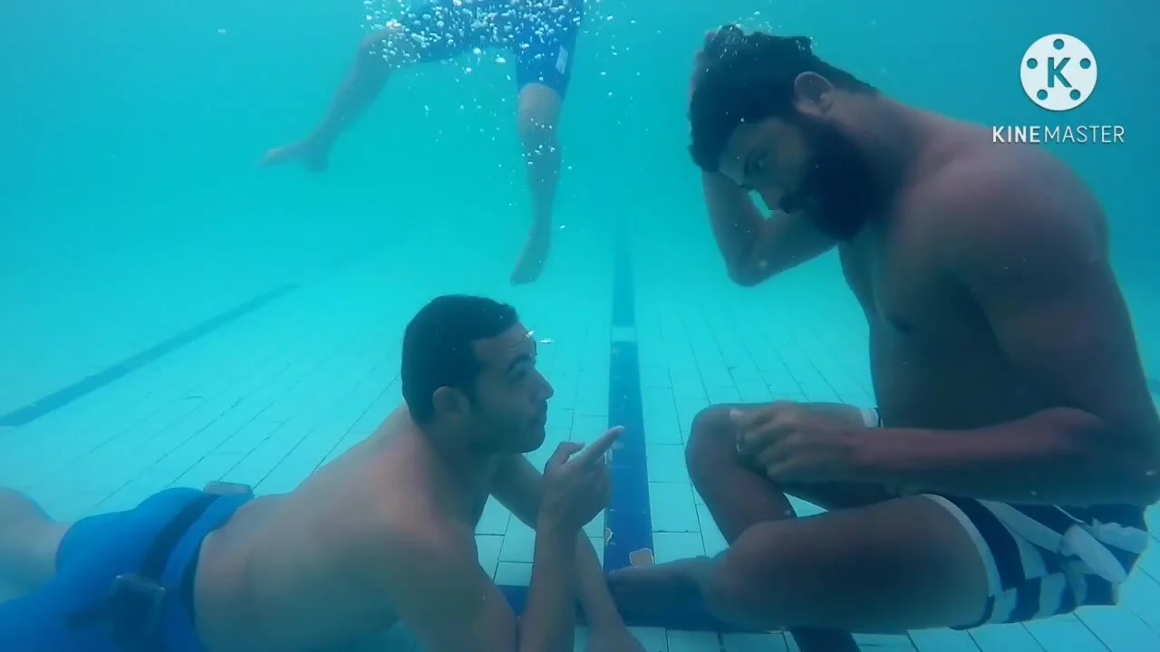 Arab guys talking and having fun underwater pic