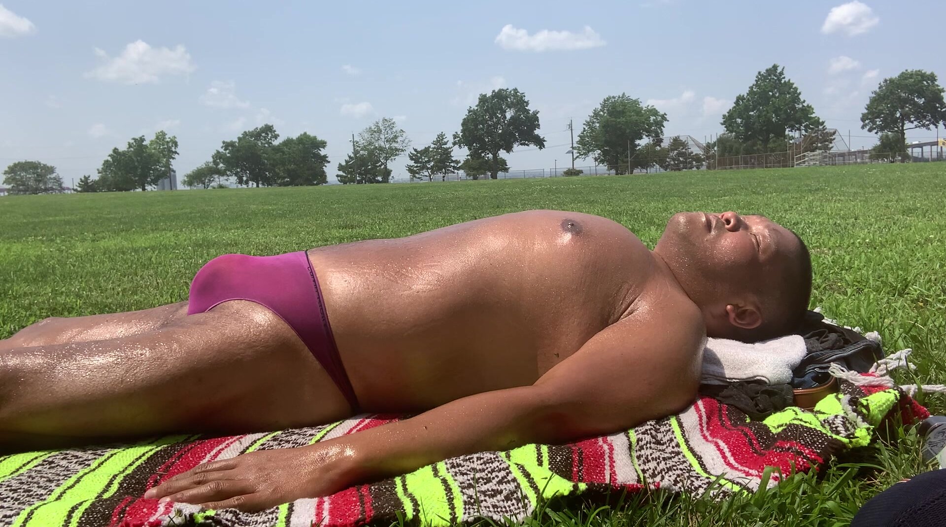 Sunbathing in  Bayonne Park  in purple thong - video 2